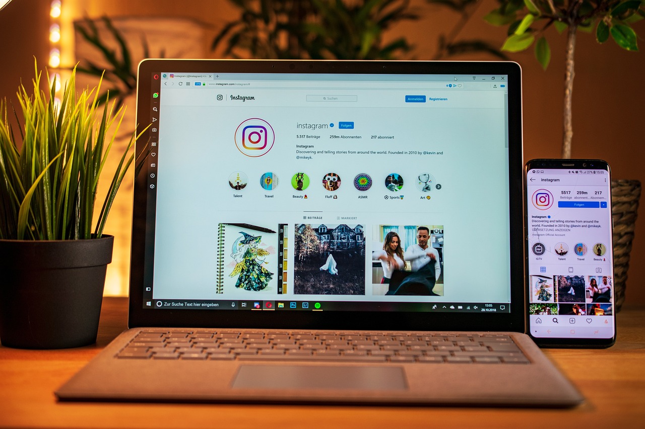 social media platform Instagram profile on laptop and phone